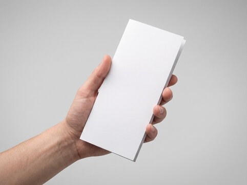 Man Hand Holding Blank White DL Flyer Brochure Mockup