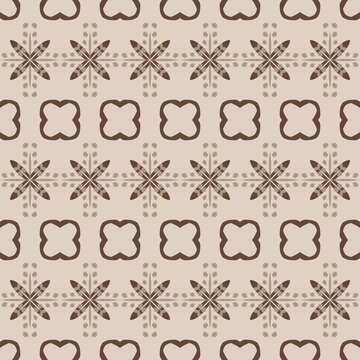 Brown geometric pattern on beige background. Repeating motifs include crosses and quatrefoils. Design features delicate, evenly spaced accents. Style suitable for textiles, wallpaper, or packaging