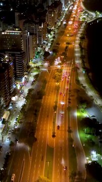 Florian&oacute;polis, Beira Mar Norte Avenue. Aerial night view. Establishing shot. Santa Catarina. Vertical video.