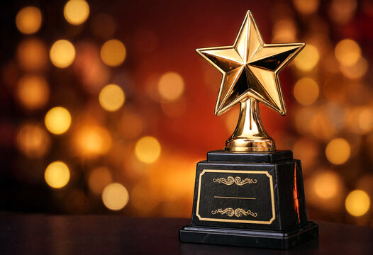 Golden star trophy award with decorative base on bokeh lights background perfect for success celebration