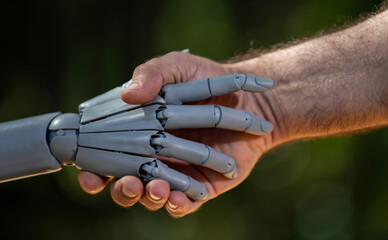 Robot hands with human bioengineering. Human hands in robotic biotech. Robot hands on innovation...