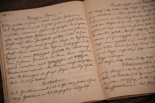 Close-up of beautiful calligraphy script in a notebook.
