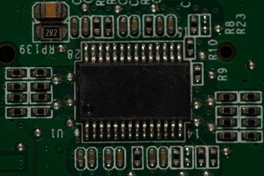 Circuit board for computing hardware. Circuit board with cpu data. Circuit board in microprocessor technology. Circuit board as computer background.