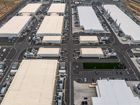 Aerial view of Vantage Data Centers featuring large industrial buildings, cooling infrastructure, and paved roads in Quincy, Washington, United States.