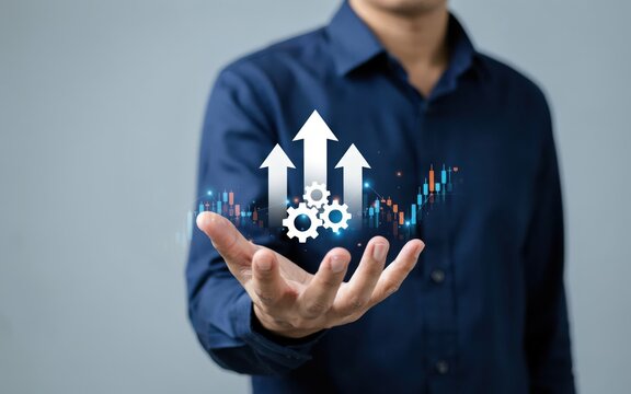 Businessman holding digital growth arrows and gears