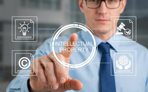 Businessman touching an intellectual property concept