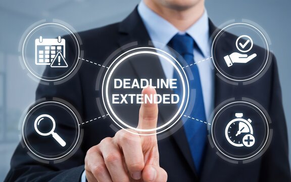 Businessman pressing a virtual button with the text deadline extended
