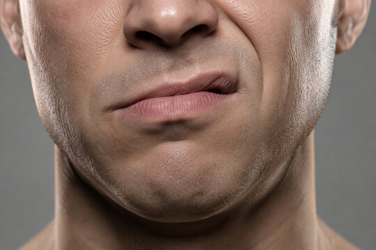 Sneering mouth close-up, emotion and attitude concept