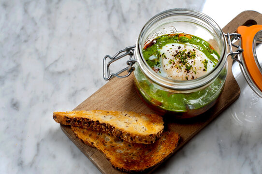 ratatouille, poached egg, gourmet food, french cuisine, artisan toast, breakfast, brunch, healthy food, mediterranean food, baked egg, pesto, basil pesto, vegetable dish, homemade food, restaurant mea