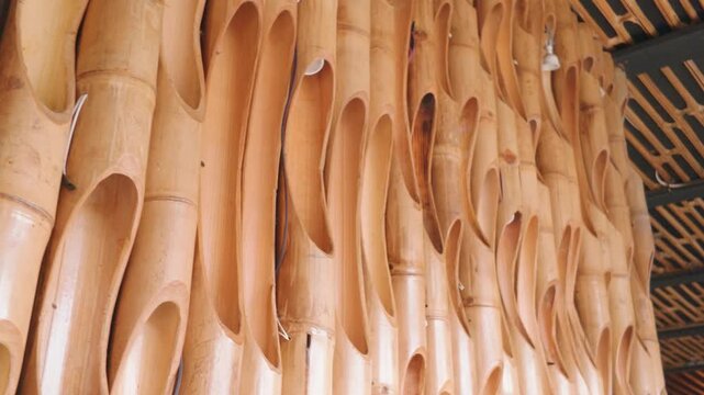 Decorative bamboo wall paneling with hollow cut sections for interior design.