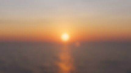 Fototapeta premium Golden sunset over the calm ocean with reflection on the water surface.