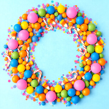 Bright colorful candy wreath with candy balls and sprinkles arranged in a circle design