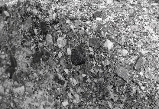 Closeup texture of rough crushed stone and gravel showing natural rock fragments