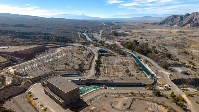 Aerial view of Dique Punta Negra hydroelectric dam and power plant with its water canal and electrical substation in Zonda Department, San Juan Province, Argentina.