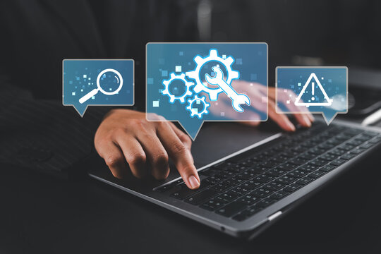 Online IT customer support. Remote help desk chat for technical support. Businesswoman using laptop computer to provide troubleshooting support.