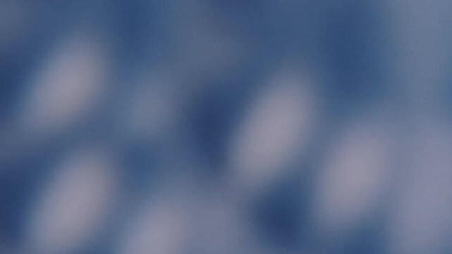 Blur glimmer. Light abstraction. Defocused blue white color optical glare radiant gleaming texture leak on luminous visual art background.