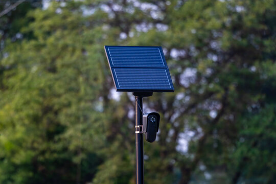 Solar powered license plate reader camera on roadside pole