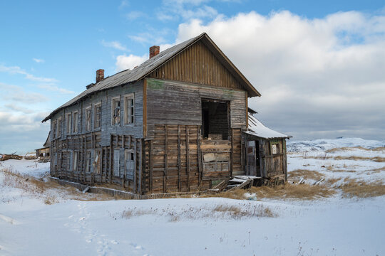 An old abandoned house in the village of Teriberka on a March day. Murmansk region, Russia