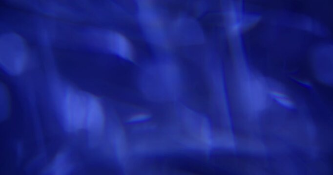 Blur light flash. Crystal lens flare. Blue color cold rainbow optical texture gleam twinkle on abstract background with bokeh effect.