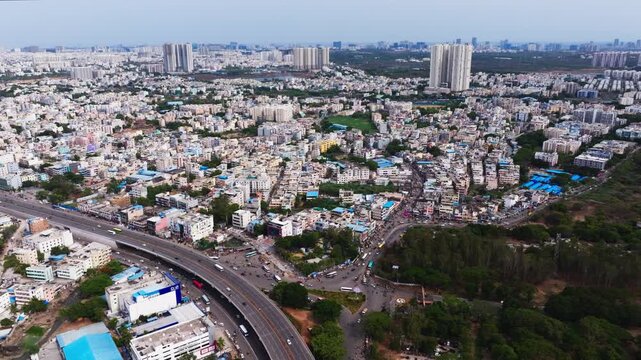 Cityscape of lingampally with BHEL Township, flyover and high-rise buildings at Chanda nagar, hyderabad, telangana, india. day time, push back shot, drone shot, 4k.