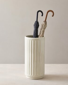 Two umbrellas in a decorative stand, ready for rainy weather