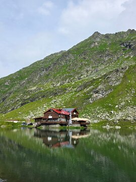 Mountain chalet on the peninsula of Balea Lake in Fagaras mountains, Romania