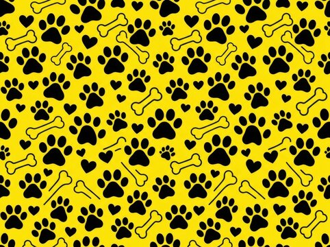 Seamless pattern with black dog paw prints, bones and hearts on a yellow background