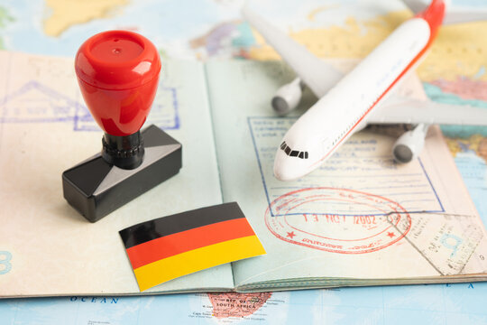 Approved Stamp  passport with Germany flag document to immigration at airport in country.
