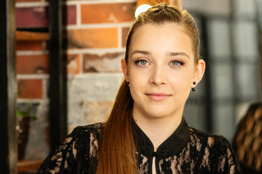 Teen Girl With Finished Makeup Looking Aside In Salon