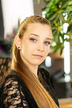Teen Girl Wearing Subtle Makeup Near Illuminated Salon Mirror