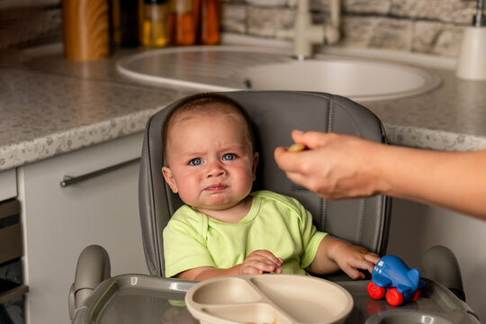 Baby Boy Reacts To First Spoonful In High Chair