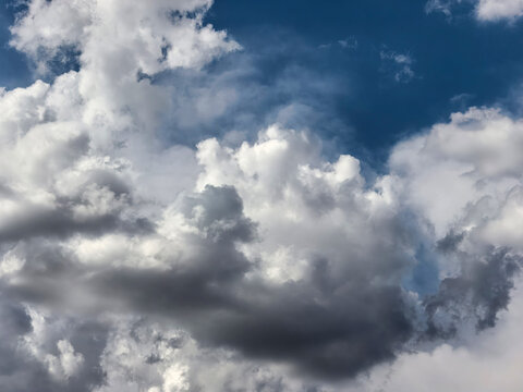 Dark Layered Cumulus Clouds Gathering in Summer Sky