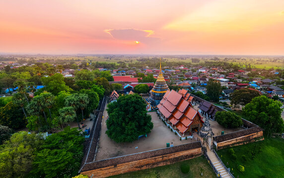 Aerial view temple Wat Phra That Lampang on sunset, Buddhist complex in Thailand.