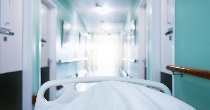 Medical, trolley and patient in bed at hospital, admission and emergency for urgent surgery. Pov, moving and transfer person in hallway with stretcher, critical care and operation room for healthcare