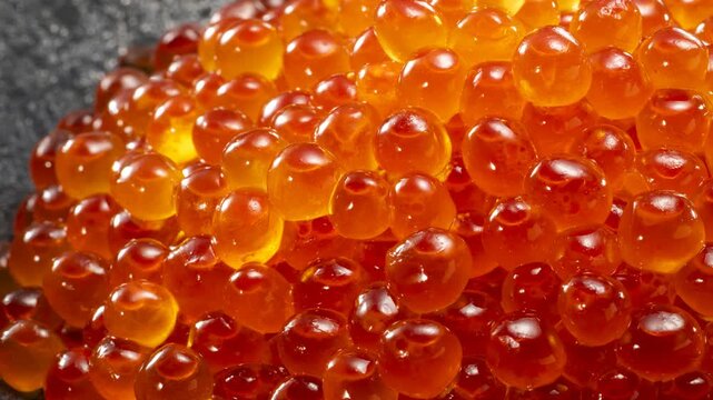 Fresh Japanese ikura salmon roe marinated in soy sauce served on wooden spoon