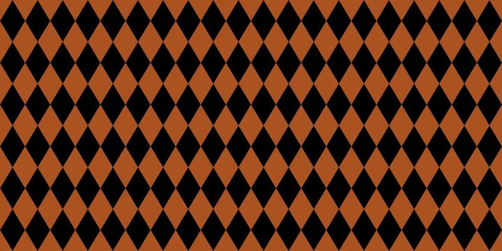Seamless harlequin diamond pattern with black and orange geometric rhombuses. Vintage argyle background for Halloween, autumn, fabric, and wallpaper design.