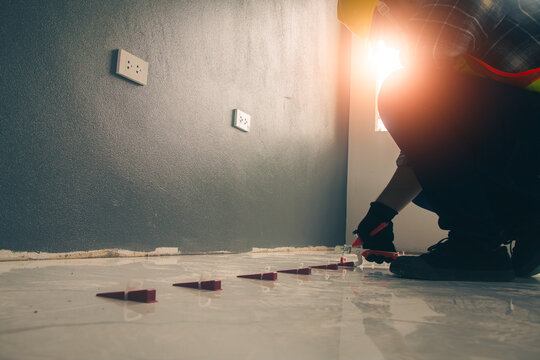 Technicians use Tile leveling pliers Leveling wedges Tile leveling clips to lay tiles.