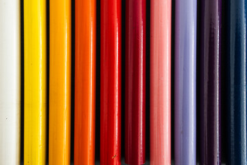 close-up of colored pencil barrels neatly lined up in colour wheel order, concept of creativity and education © faithie
