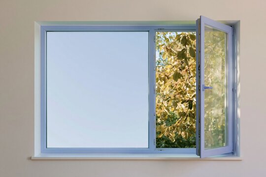 Plastic casement window standing slightly open in a bare room, featuring a smooth lavender frame and copy space for home insulation marketing