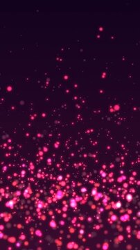 Pink glowing particles on dark background. 2d animation