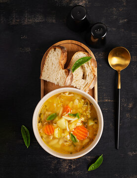 Healthy Chicken Soup with Orzo Pasta and Herbs. Top view