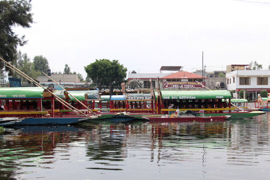 Mexico City, Mexico - May 6, 2026: Colorful trajineras on the canals of Xochimilco for family gatherings and celebrations with friends in the south of CDMX