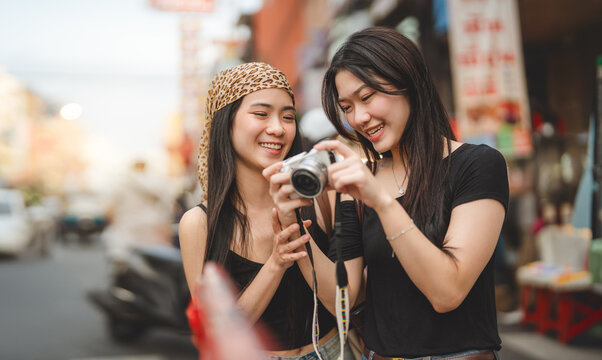 Two young asian woman gen z sisters street food travel at Chinatown Yaowarat