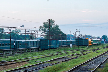 Railway Yard with Multiple Train Tracks and Freight Wagon Cars © CreativeAi