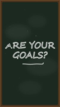 Stop motion animation of hand drawing text what are your goals on a dark green blackboard texture