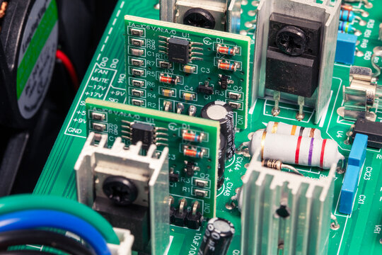 Printed circuit board of amplifier, electronic device with components. Close-up, macro shot