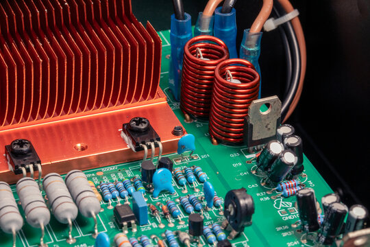 Electronic circuit board, transistors, resistors, capacitors, and diodes on the printed of an amplifier circuit board, close up