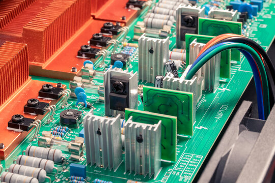 Electronic circuit board, transistors, resistors, capacitors, and diodes on the printed of an amplifier circuit board, close up