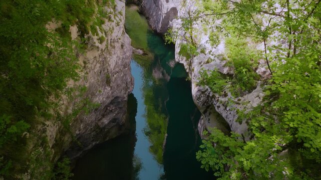 Sentiero del Dint view of fresh mountain water cascading over stones in the forested Cellina gorge, Italy