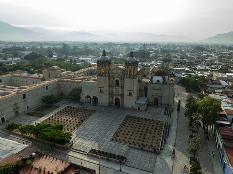 Aerial view of Templo de Santo Domingo de Guzman with its historic stone facade and twin towers overlooking the plaza in Oaxaca de Juarez, Oaxaca, Mexico.